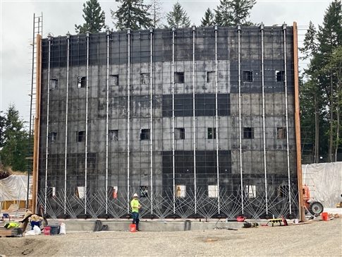The first wall frame is erected for construction of a new 7.5 million gallon water storage tank in south Eugene