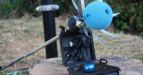 Picture of a blue foam ball covering an acoustic sensor hooked up to a laptop