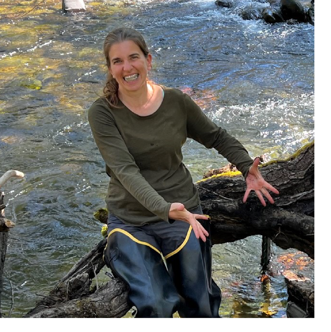 Lisa Erkert takes water quality samples from the McKenzie River