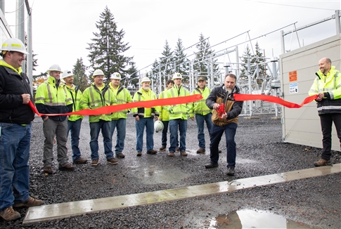 Commissioner McRae cuts the ribbon for the Currin Substation