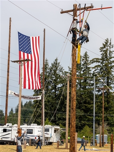 team on power pole at rodeo